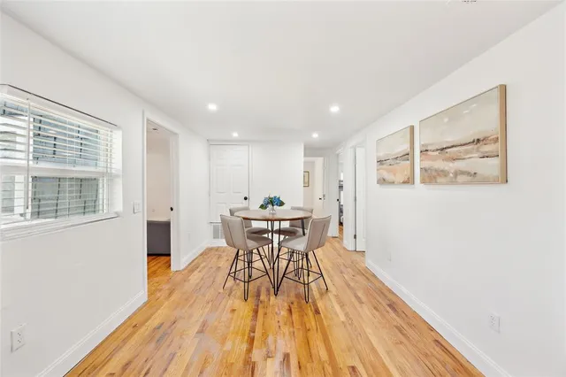 a bedroom with a bed couch and window