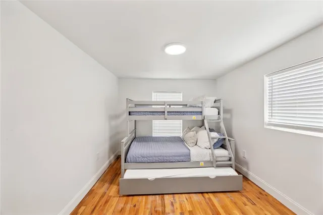 a bedroom with a bed and a lamp