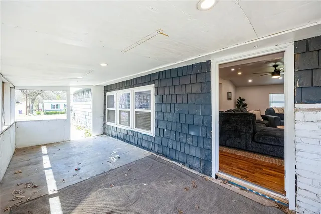 a view of front door and bedroom with a large window