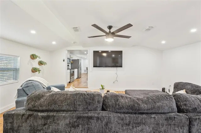 a living room with a couch and a flat screen tv