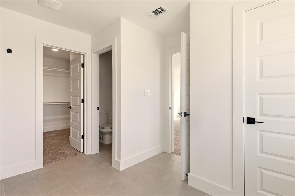 8902 Lowell Street Rowlett, TX 75089 - Photo 18 of 32 a view of a bathroom with a shower