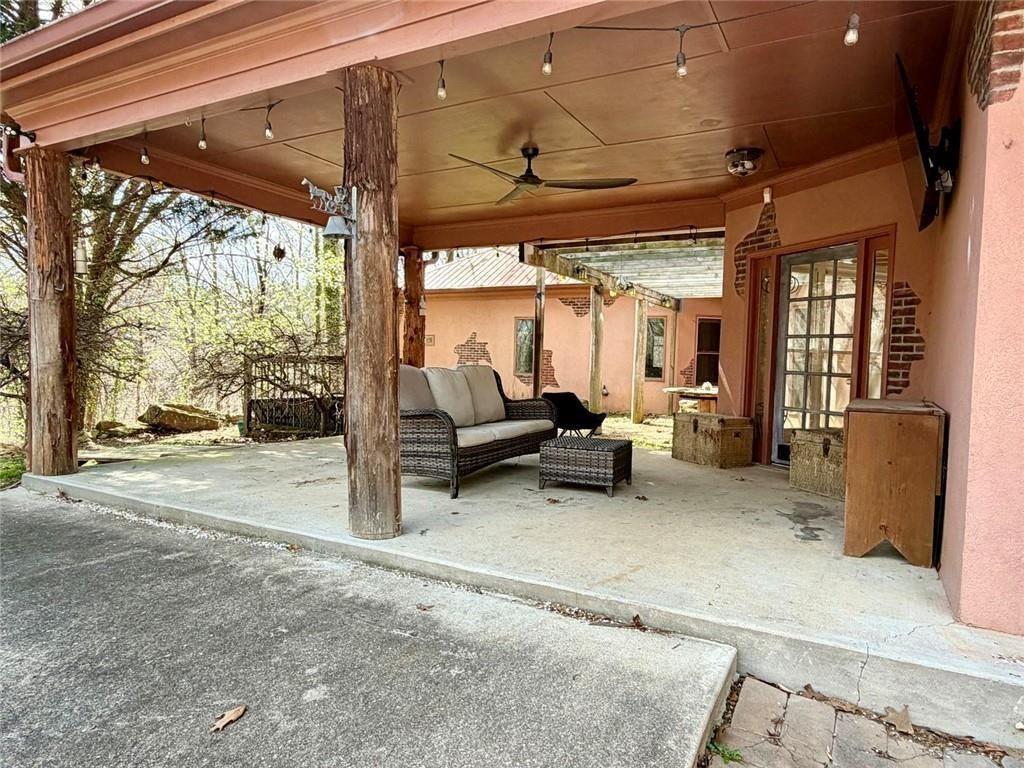 9011 High Point Road Villa Rica, GA 30180 - Photo 13 of 68 a living room with furniture and a floor to ceiling window