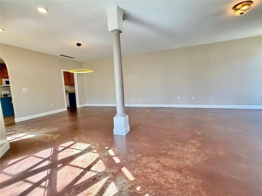 9011 High Point Road Villa Rica, GA 30180 - Photo 14 of 68 a view of a big room with wooden floor and windows