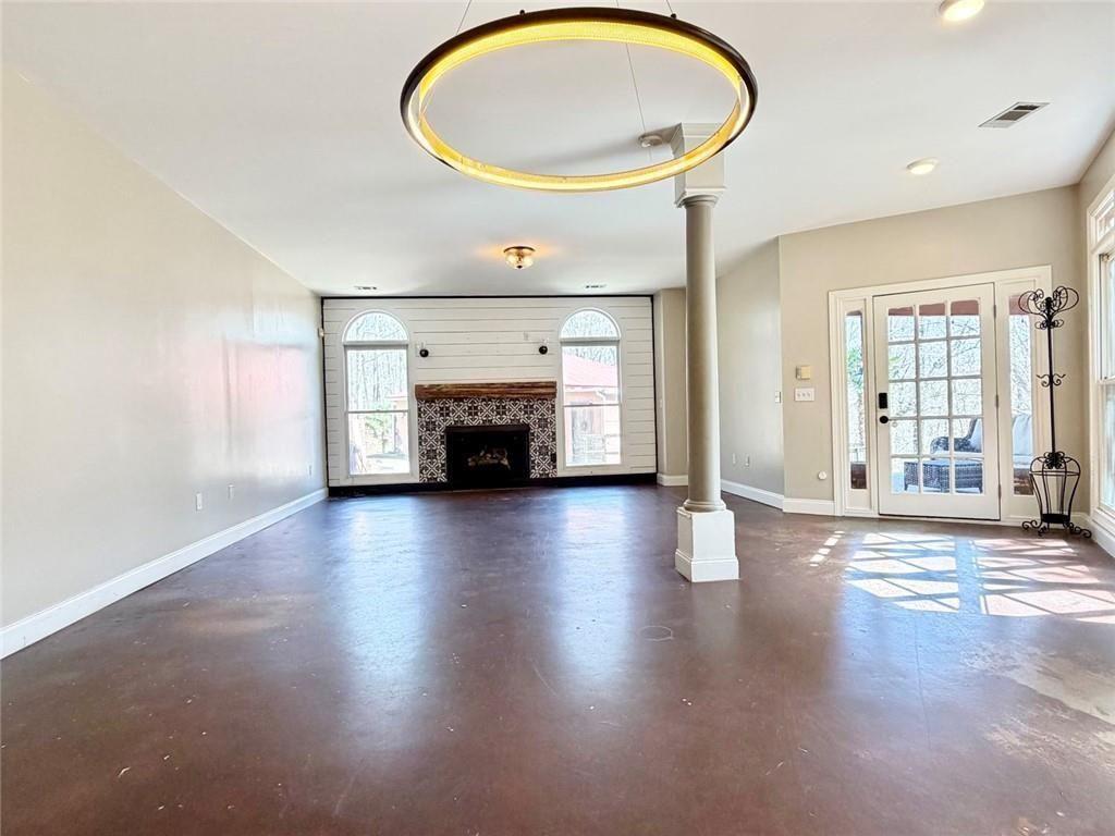 9011 High Point Road Villa Rica, GA 30180 - Photo 18 of 68 an entryway with fireplace and wooden floor