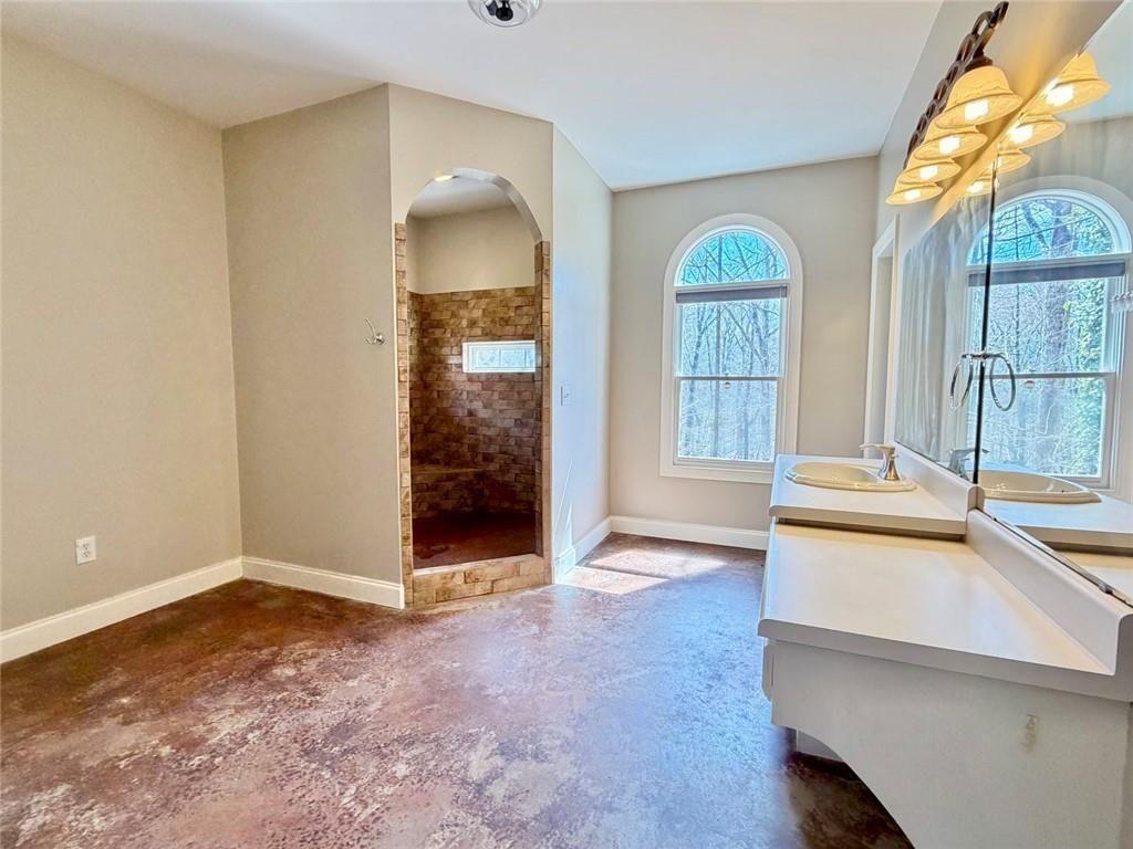 9011 High Point Road Villa Rica, GA 30180 - Photo 31 of 68 a view of an empty room with glass door and wooden floor