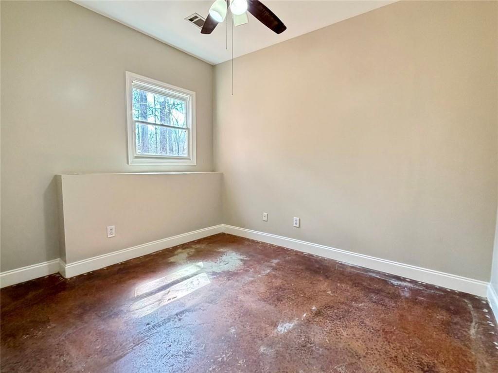9011 High Point Road Villa Rica, GA 30180 - Photo 35 of 68 an empty room with a window and a fan