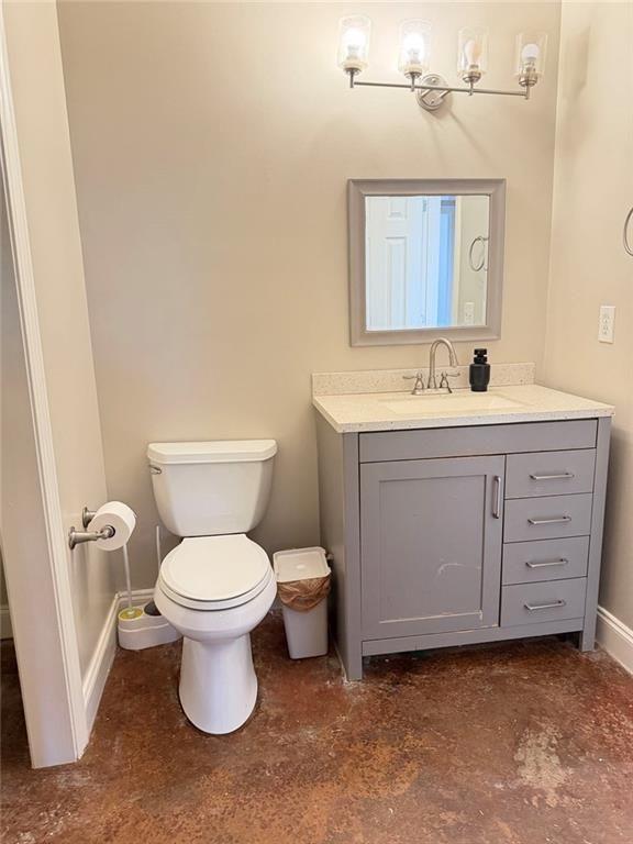 9011 High Point Road Villa Rica, GA 30180 - Photo 39 of 68 a bathroom with a toilet a sink and mirror