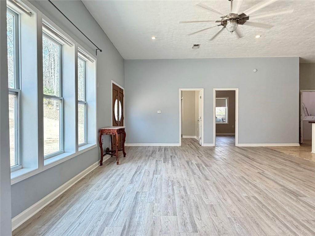 9011 High Point Road Villa Rica, GA 30180 - Photo 43 of 68 a view of empty room with wooden floor and fan