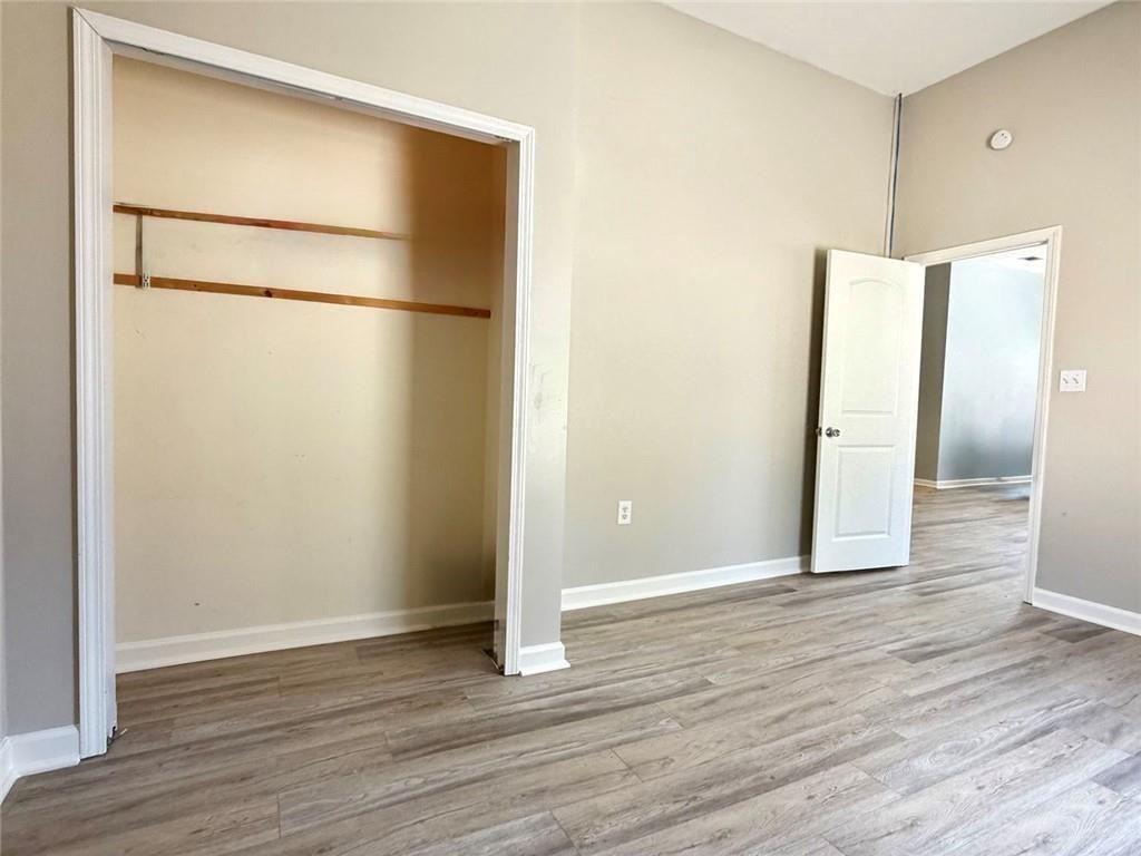 9011 High Point Road Villa Rica, GA 30180 - Photo 49 of 68 a view of an empty room with wooden floor