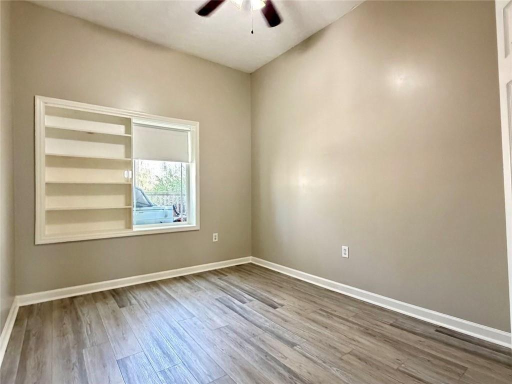 9011 High Point Road Villa Rica, GA 30180 - Photo 50 of 68 an empty room with wooden floor and windows