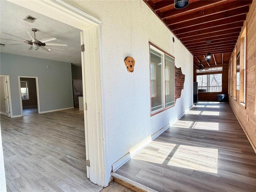 9011 High Point Road Villa Rica, GA 30180 - Photo 54 of 68 a view of a hallway view with wooden floor and staircase
