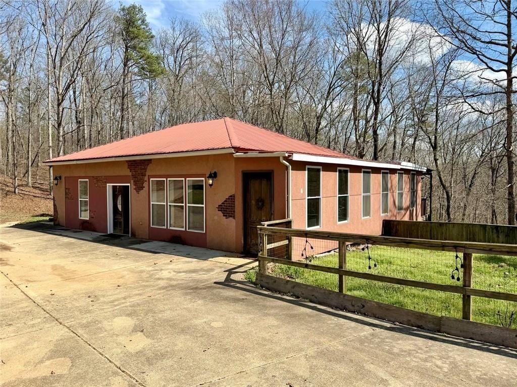 9011 High Point Road Villa Rica, GA 30180 - Photo 10 of 68 a front view of a house with yard and sitting area