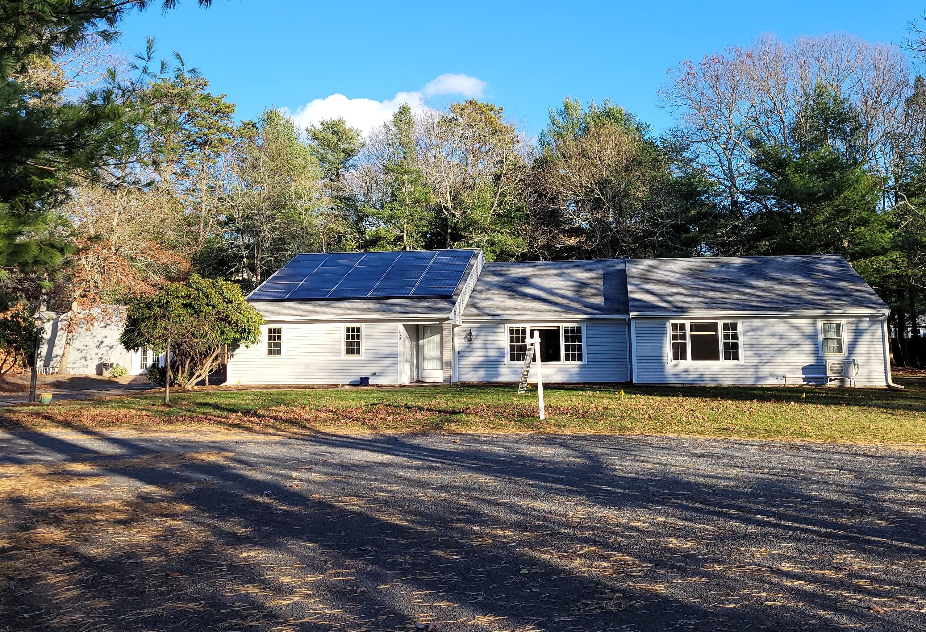130 Foxglove Road Centerville, MA 02632 - Photo 1 of 65 a view of a house with a big yard and large trees