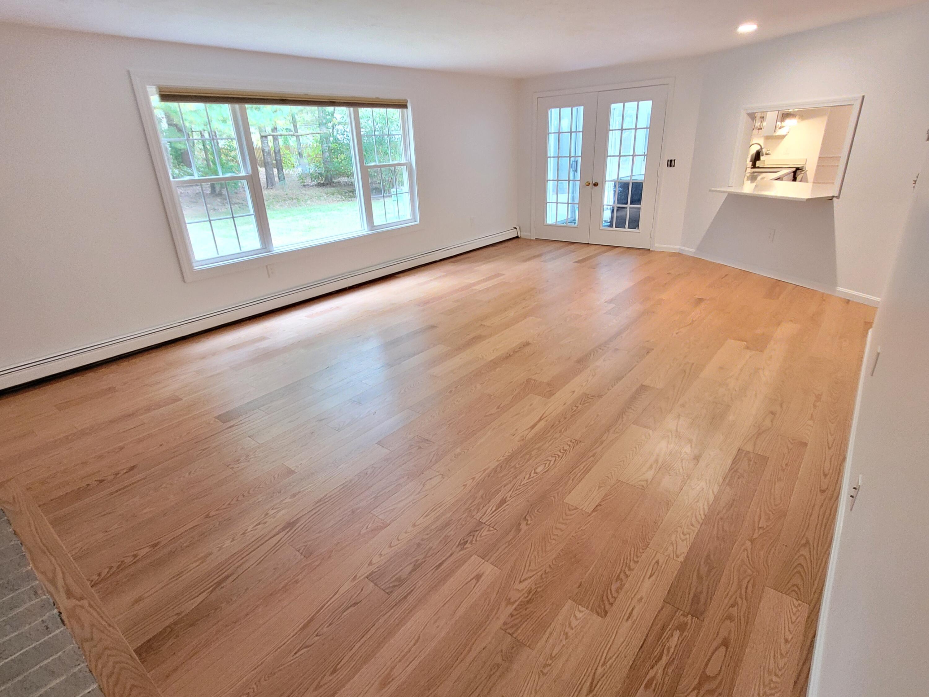 130 Foxglove Road Centerville, MA 02632 - Photo 26 of 65 a view of an empty room with wooden floor and a window