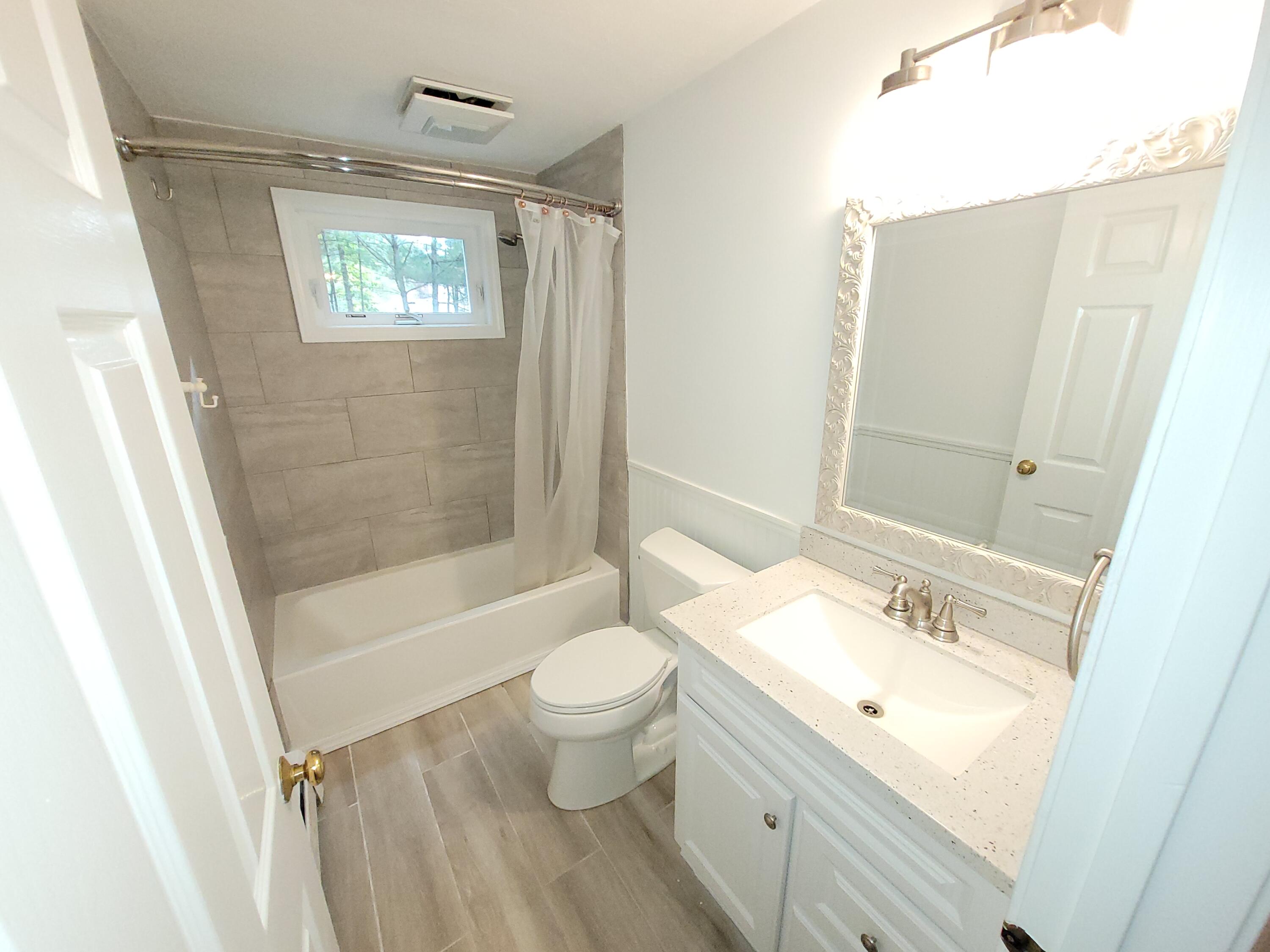 130 Foxglove Road Centerville, MA 02632 - Photo 37 of 65 a bathroom with a sink a toilet and shower