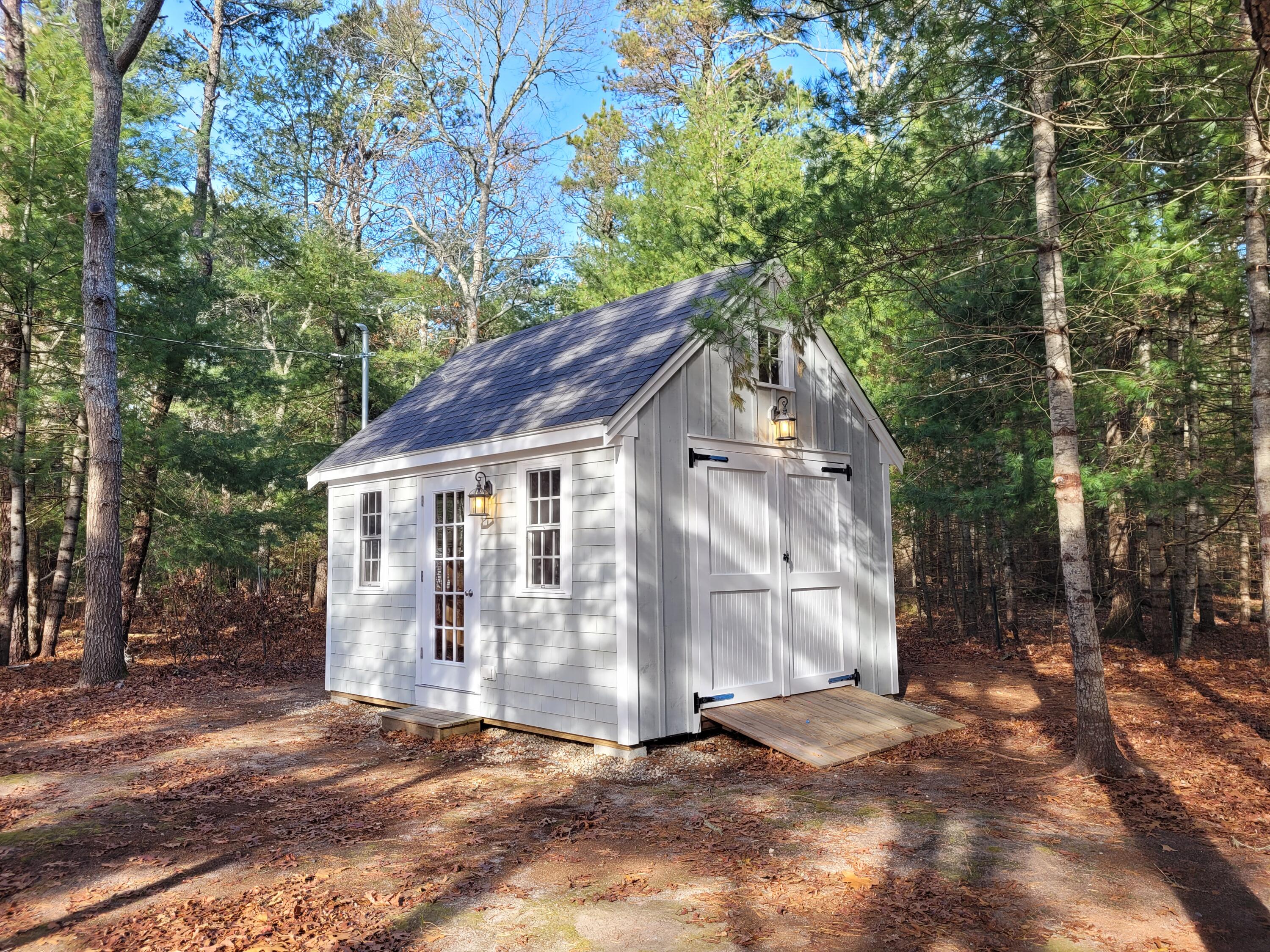 130 Foxglove Road Centerville, MA 02632 - Photo 54 of 65 a view of a house with a yard