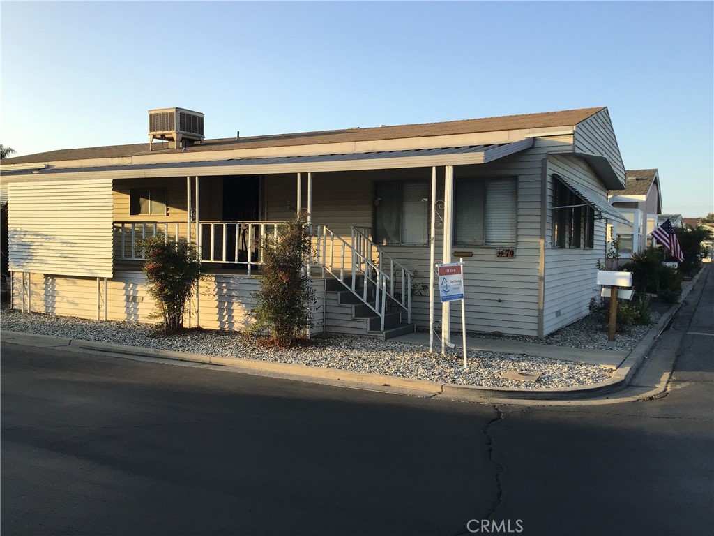 7271 Katella Stanton, CA 90680 - Photo 1 of 43 front view of a house with a porch