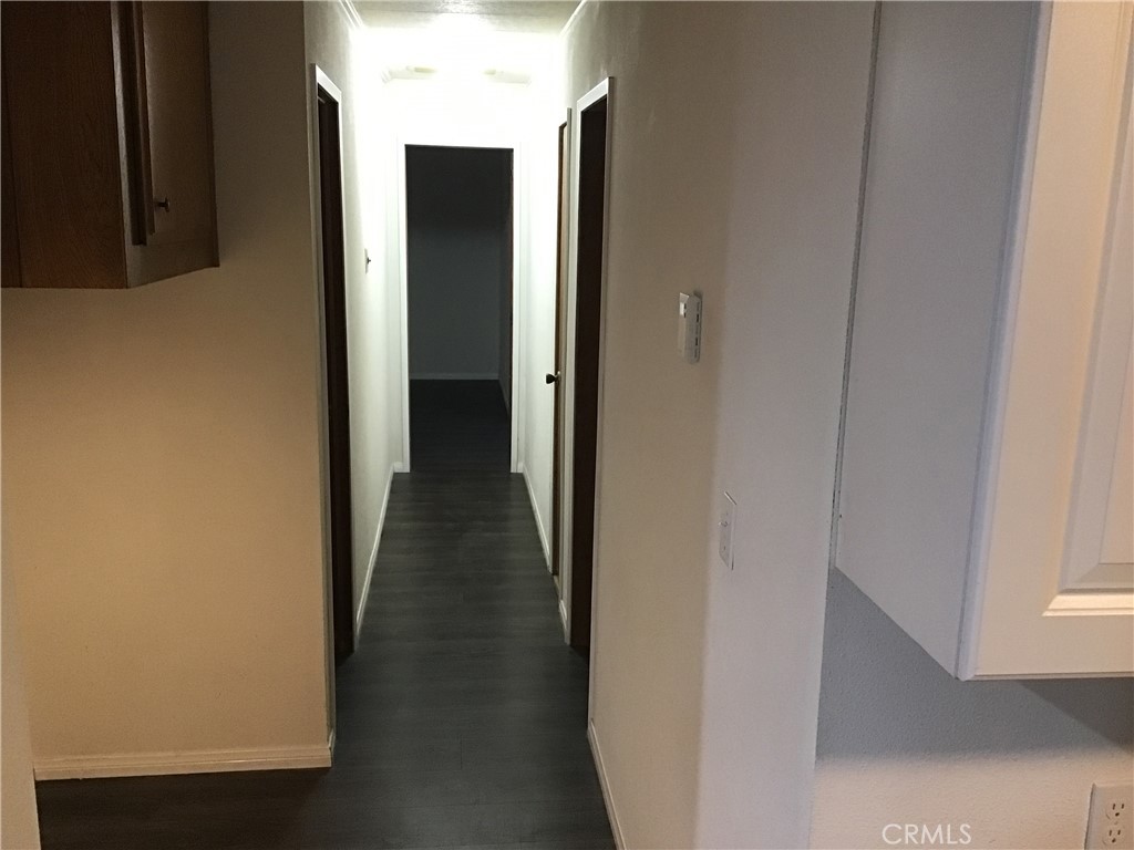 7271 Katella Stanton, CA 90680 - Photo 20 of 43 a view of a hallway with a wooden floor
