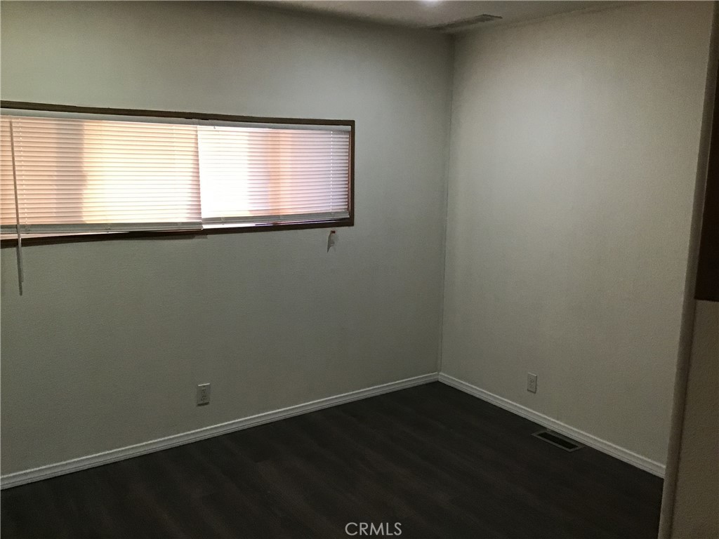 7271 Katella Stanton, CA 90680 - Photo 22 of 43 a view of a small space with wooden floor and a window