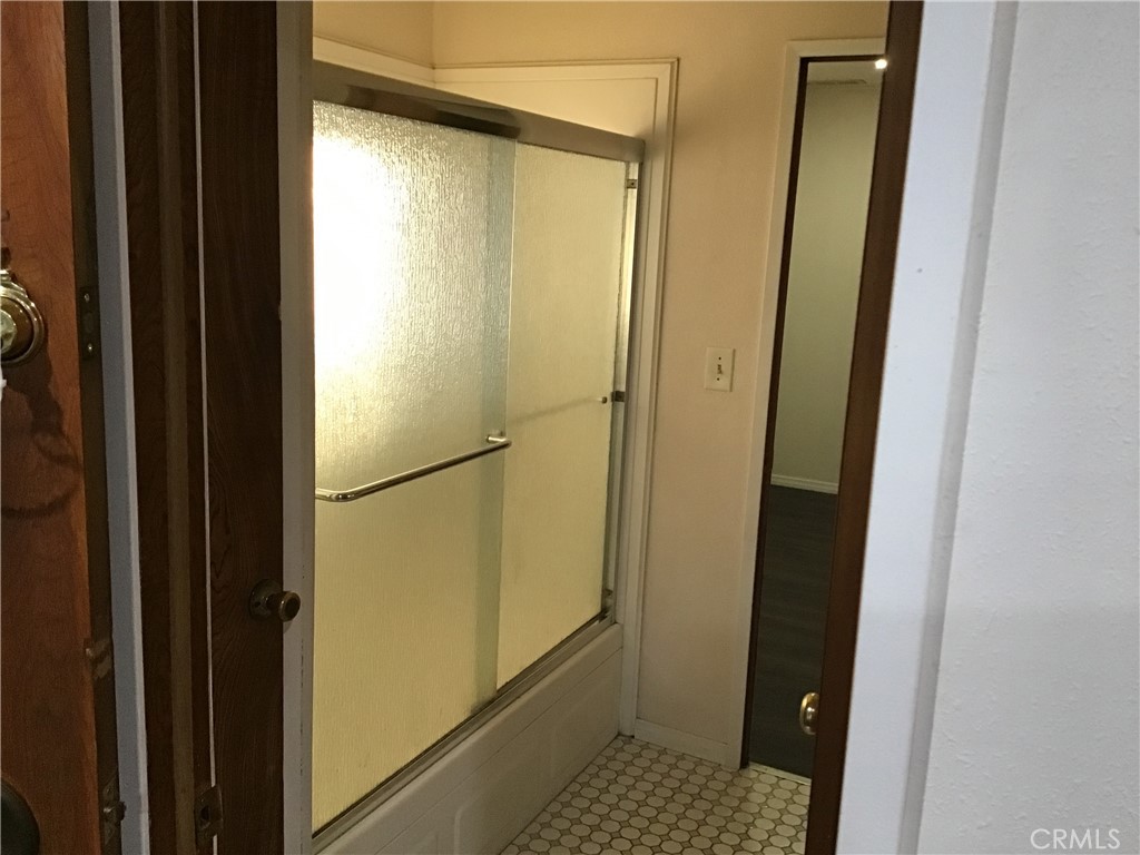 7271 Katella Stanton, CA 90680 - Photo 23 of 43 a bathroom with a glass shower door