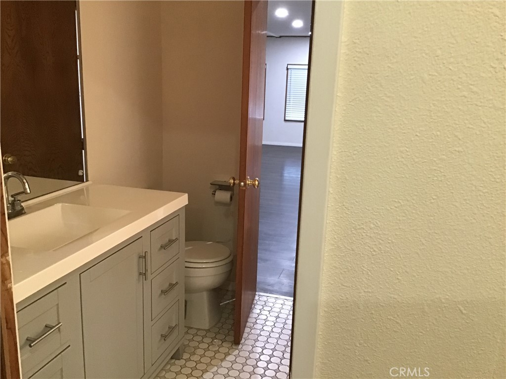 7271 Katella Stanton, CA 90680 - Photo 25 of 43 a bathroom with a sink and a toilet