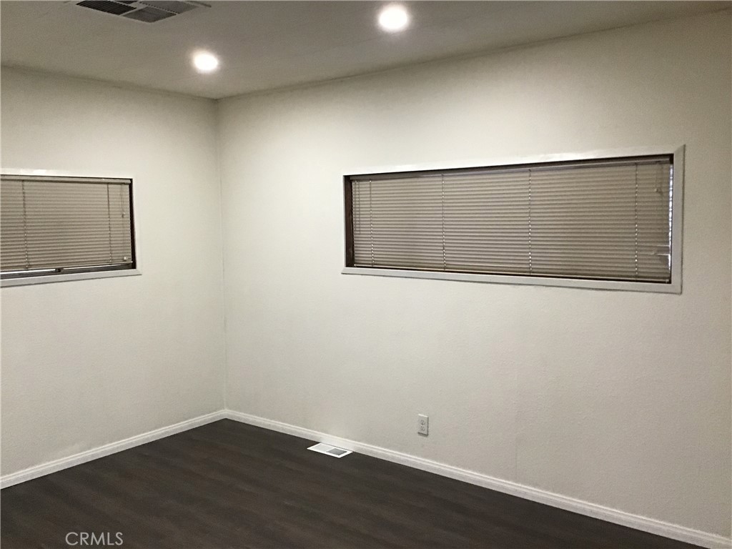 7271 Katella Stanton, CA 90680 - Photo 30 of 43 an empty room with wooden floor
