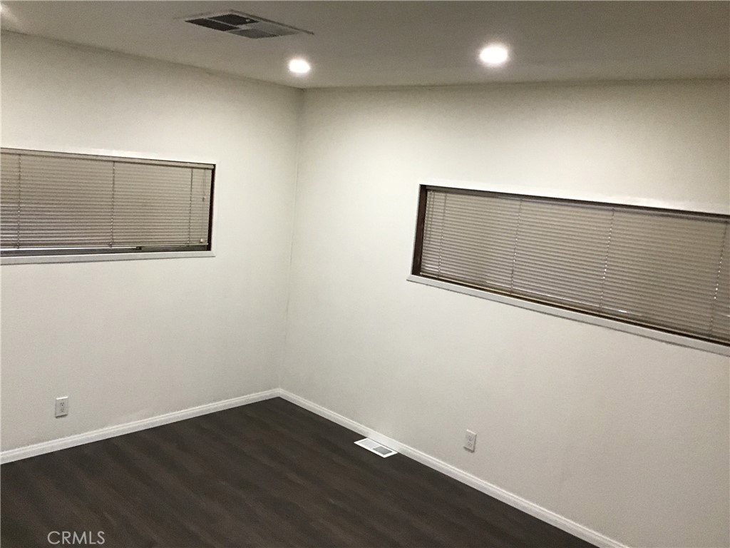7271 Katella Stanton, CA 90680 - Photo 31 of 43 an empty room with wooden floor