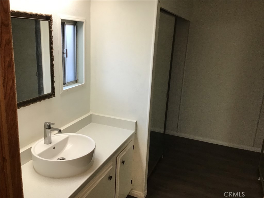 7271 Katella Stanton, CA 90680 - Photo 33 of 43 a bathroom with a sink and a mirror