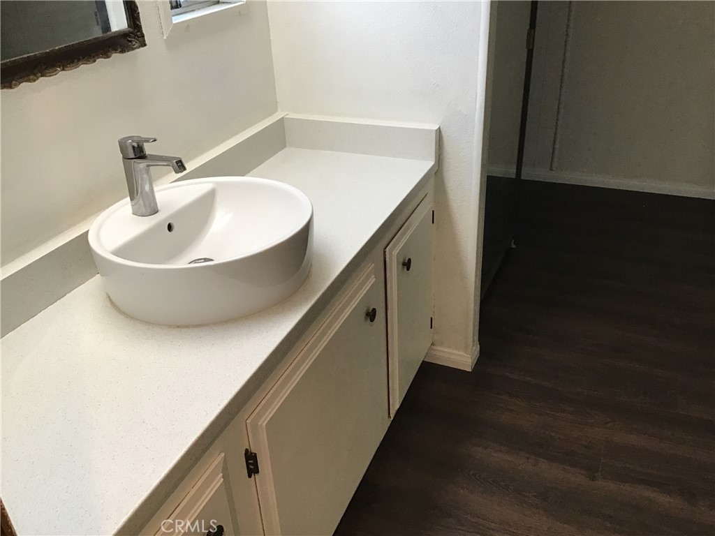 7271 Katella Stanton, CA 90680 - Photo 34 of 43 a bathroom with a sink and a mirror