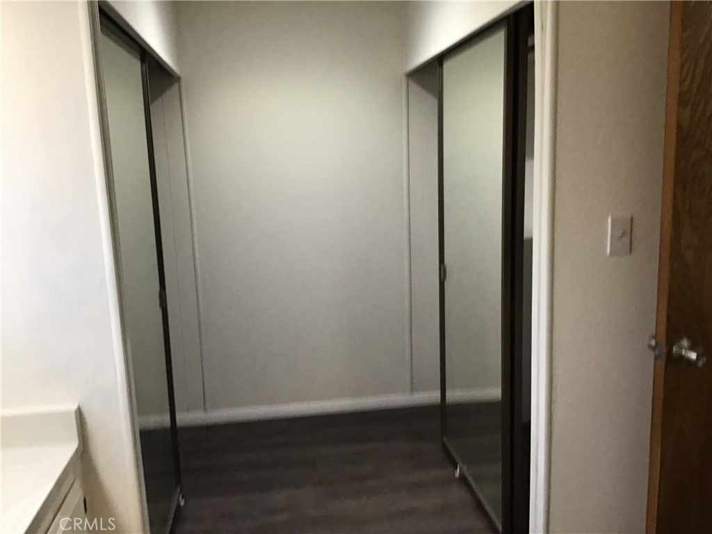 7271 Katella Stanton, CA 90680 - Photo 37 of 43 a view of hallway with wooden floor