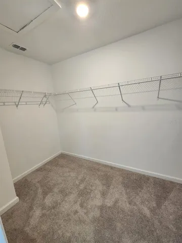 a view of a room with racks on the wall