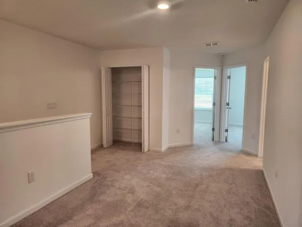an empty room with closet area