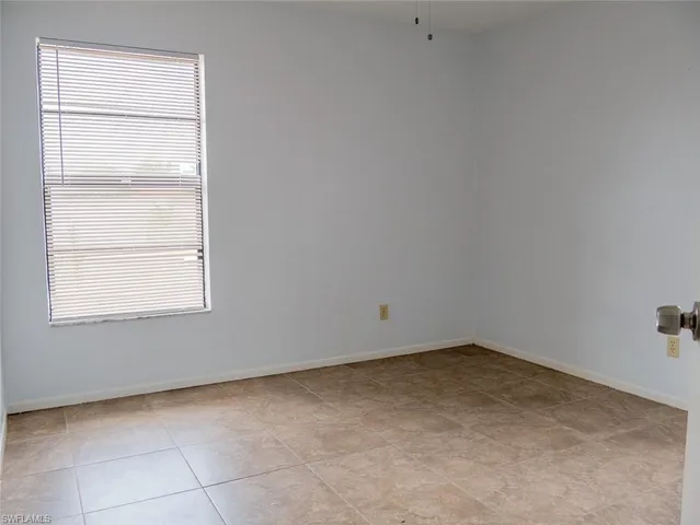 a view of a room that has a window in it