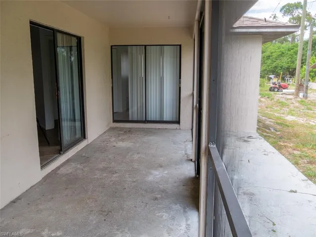 a view of a room that has a large window