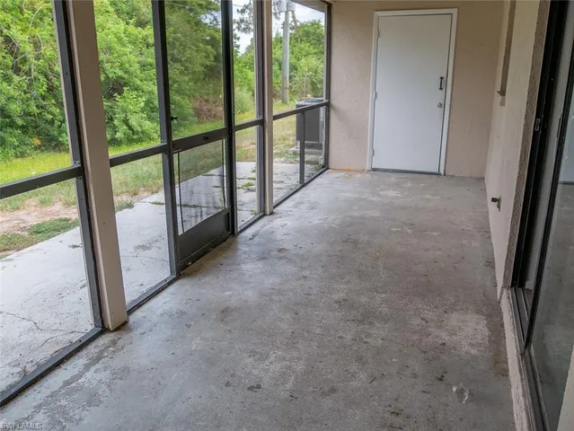 a view of a room with large windows