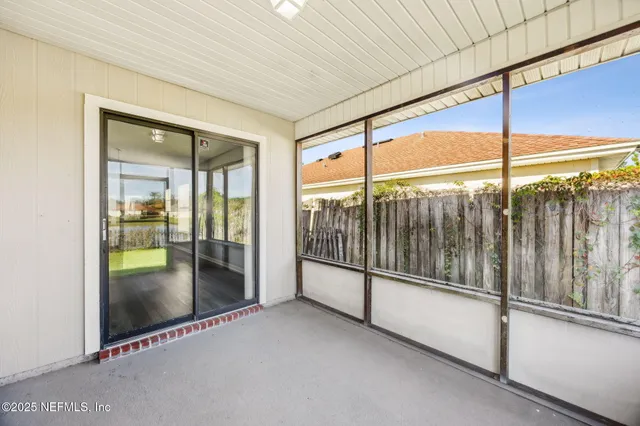 a view of empty room with floor to ceiling window