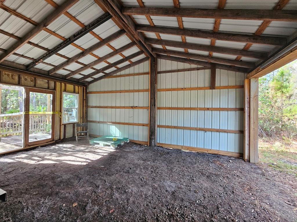 804 Shell Harbor Road Pierson, FL 32180 - Photo 24 of 27 a view of an empty room with a balcony