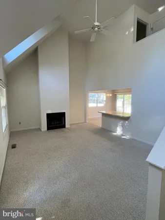 a view of an empty room and a window