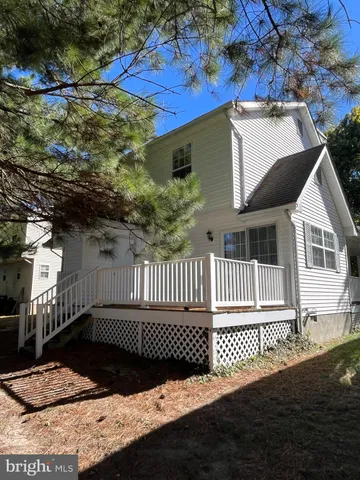 a view of a balcony with a barbeque