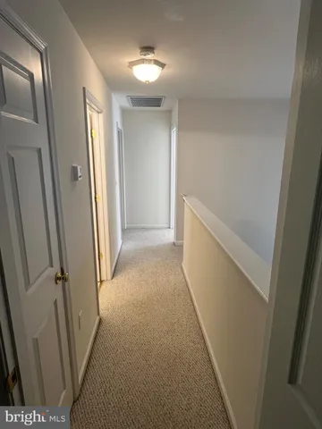 a view of hallway with stairs