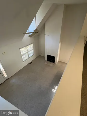 a view of an empty room with windows