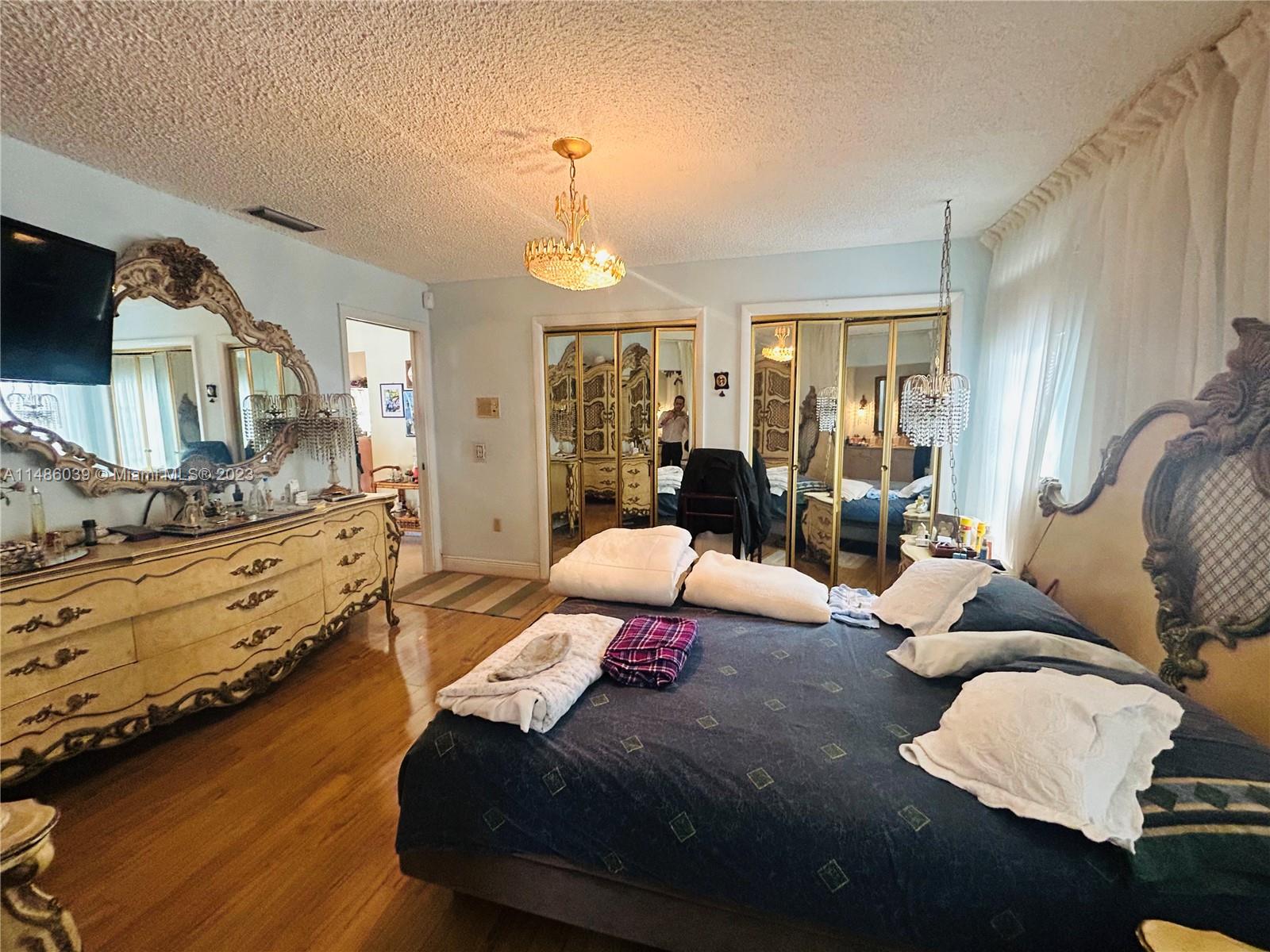 2311 Southwest 23rd Street Miami, FL 33145 - Photo 12 of 21 a bedroom with furniture and a wooden floor