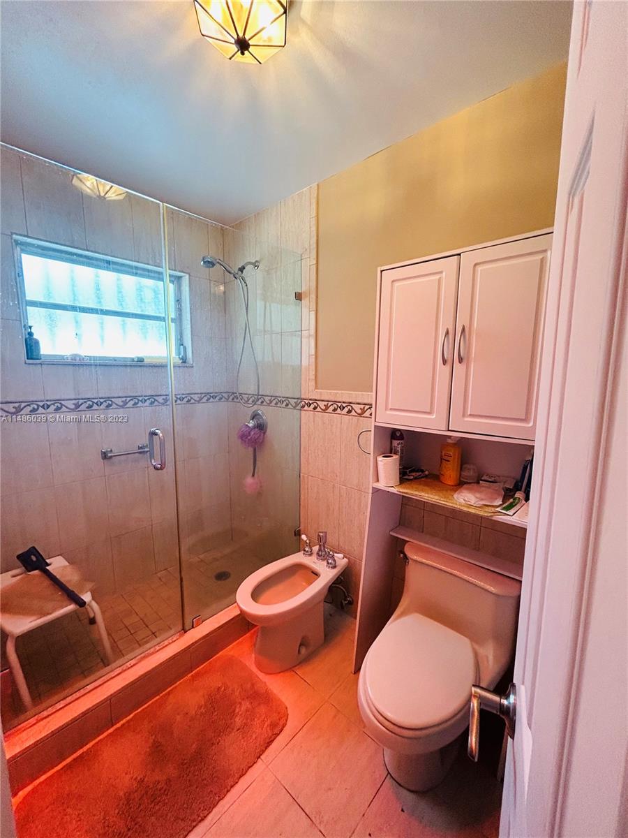 2311 Southwest 23rd Street Miami, FL 33145 - Photo 14 of 21 a bathroom with a toilet and a shower
