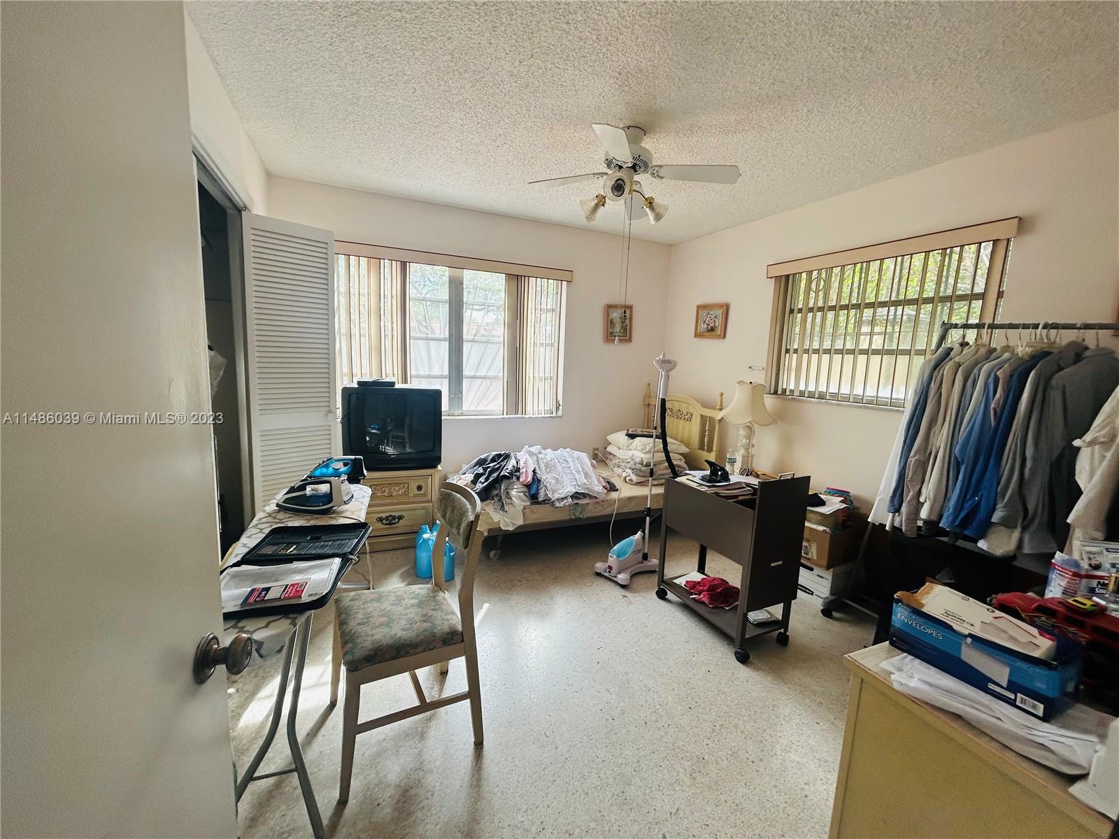2311 Southwest 23rd Street Miami, FL 33145 - Photo 16 of 21 a living room with furniture a flat screen tv and a couch