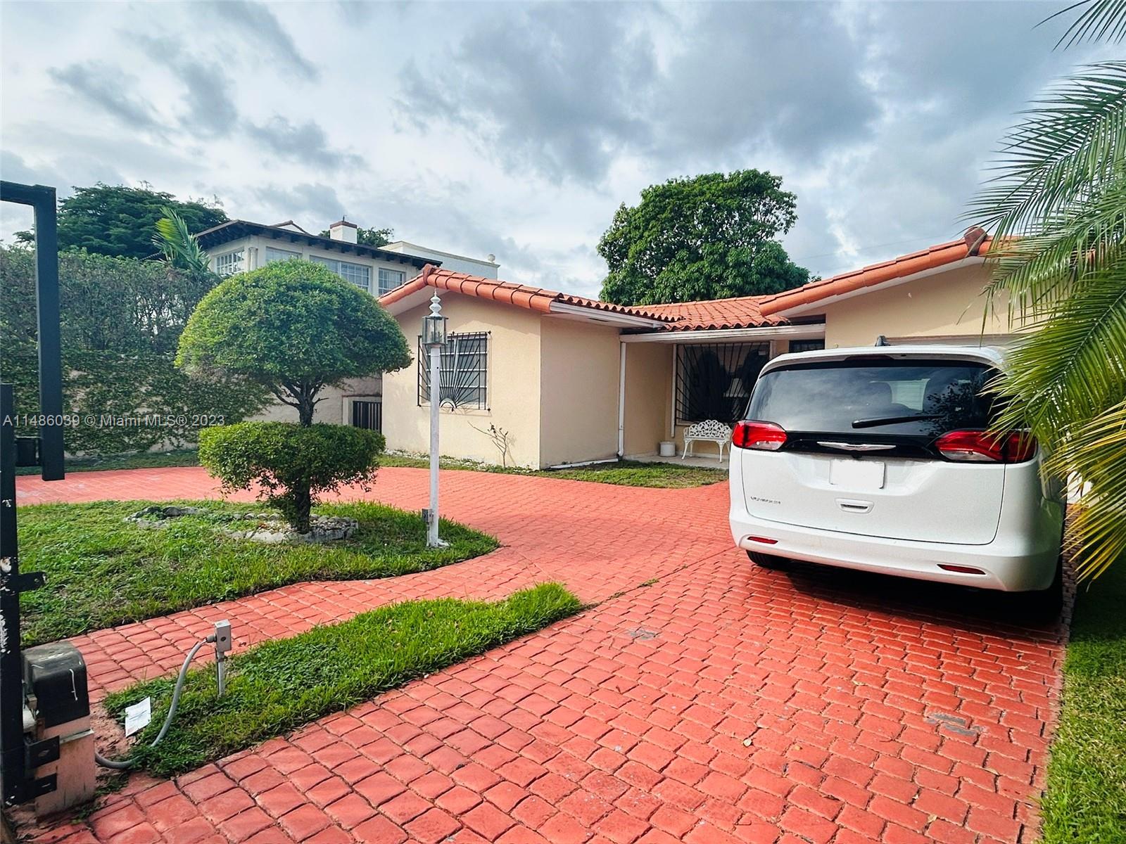 2311 Southwest 23rd Street Miami, FL 33145 - Photo 2 of 21 a house view with a garden space