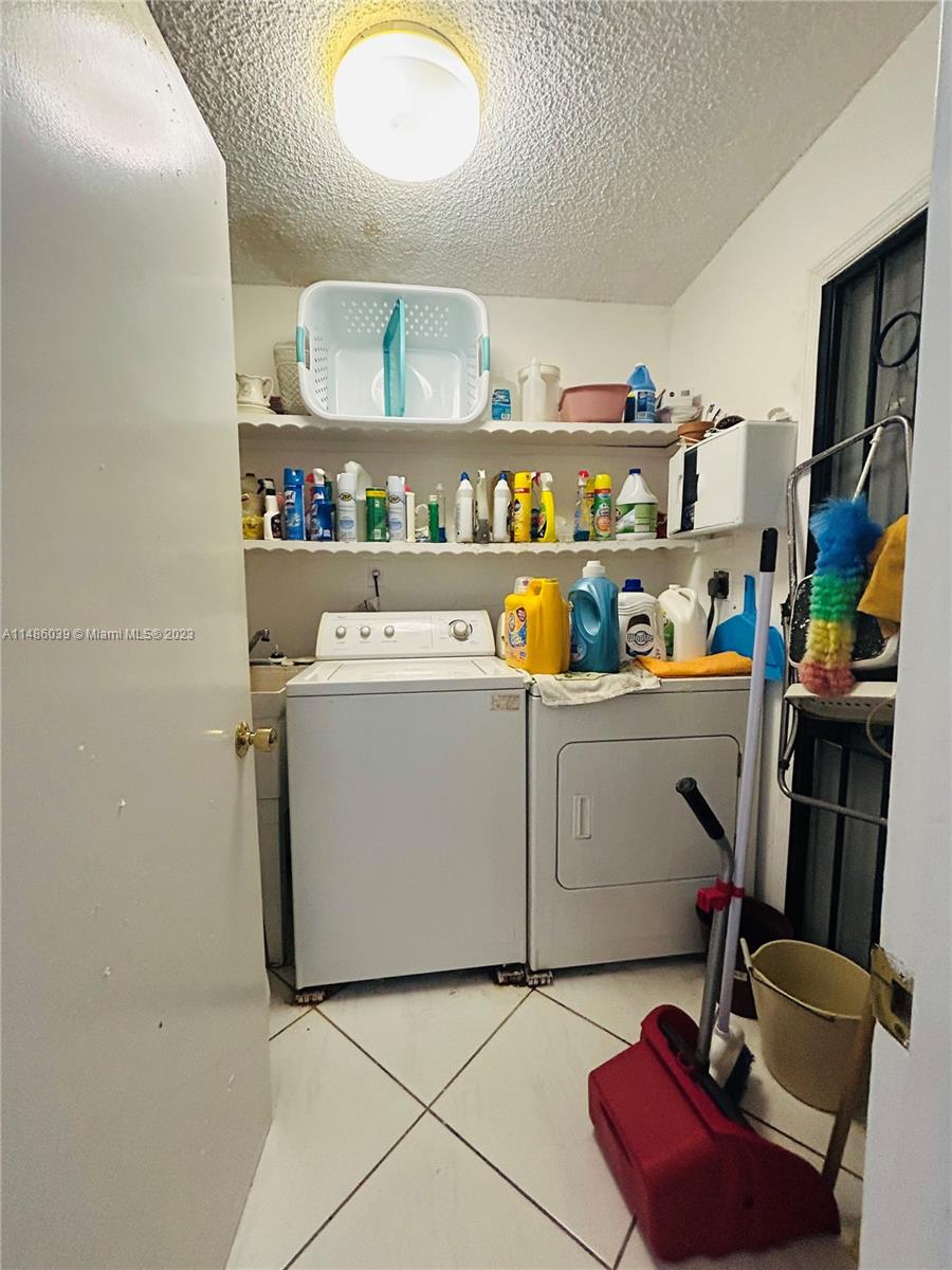 2311 Southwest 23rd Street Miami, FL 33145 - Photo 21 of 21 a utility room with washer and dryer