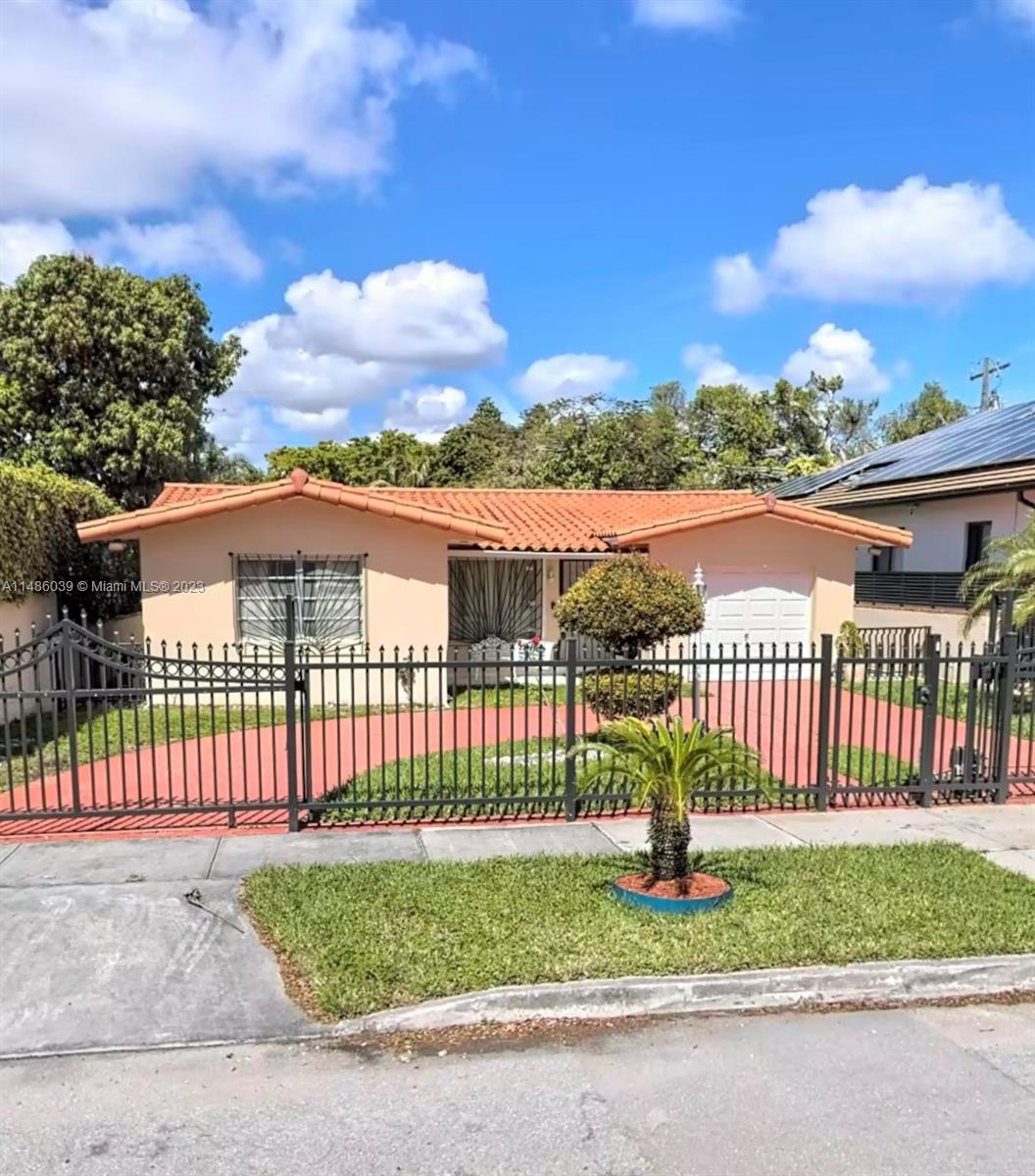 2311 Southwest 23rd Street Miami, FL 33145 - Photo 3 of 21 a view of a park with a wooden fence