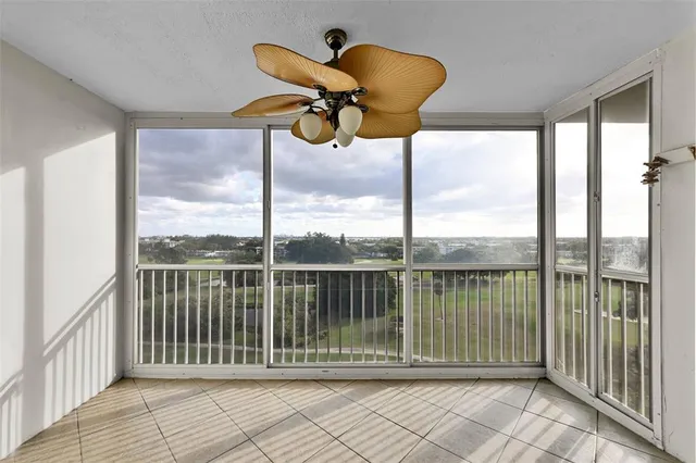 a view of a balcony with furniture
