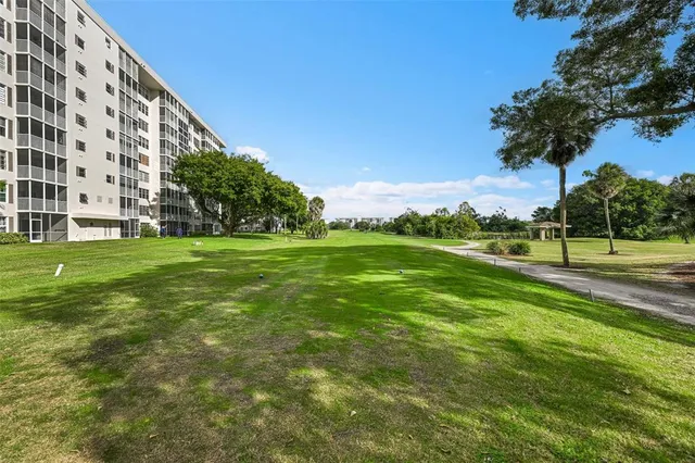 a view of a building with a big yard