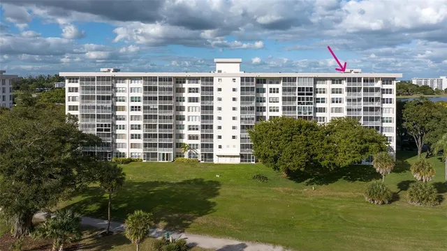 a view of building with garden space and windows